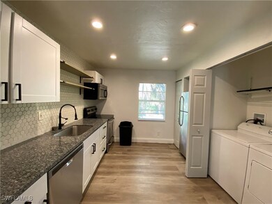 Kitchen featuring stainless steel appliances, a si