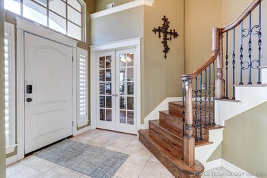 Inviting two-story entry with an office tucked awa