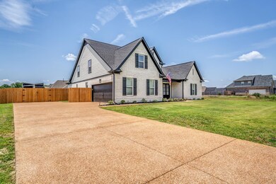 View of front facade with a garage and a front yar