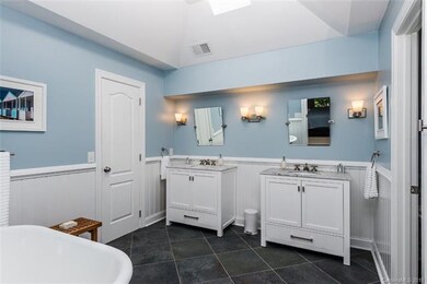 Remodeled master bathroom with large tiled shower 