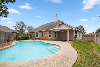 Spacious pool with lots of room to play.  Additional yard space on the backside of the home provides a grassy area as well.