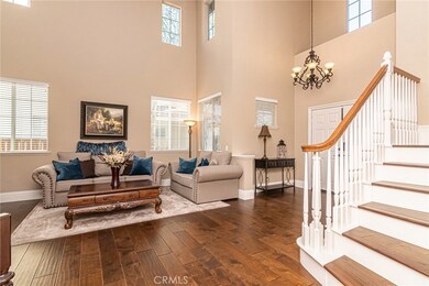 Engineered hardwood flooring up the stairs. Vaulted ceiling in living room.