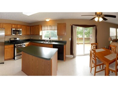 Eat-in Kitchen with all appliances! Open to great room and access to back deck!