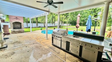 Outdoor Kitchen, Fireplace ,and Pool area