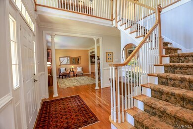 Beautiful turned staircase.  The formal living roo
