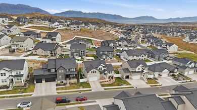 Aerial perspective of suburban area with a mountainous background