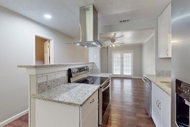 Kitchen with appliances with stainless steel finis