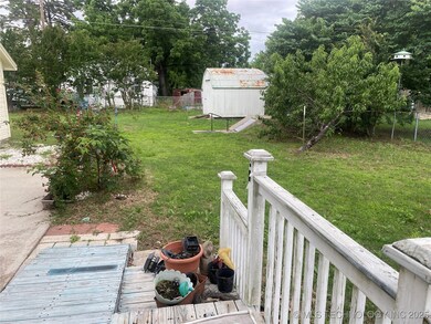 back yard. shed for lawn mower and storm cellar