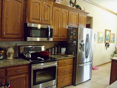 Kitchen. New Stainless Steel Microwave and free standing stove and oven.  Granite counter tops, pantry and tons of storage.