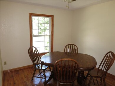 Formal dining room with wood flooring