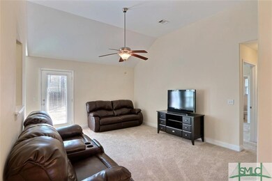 Family Room Features Vaulted Ceiling
