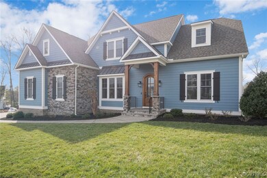 Craftsman inspired home with a front yard