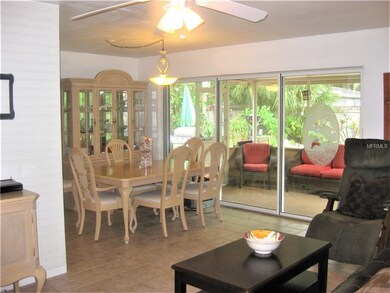 Open, modern, L-shaped living space flows from the