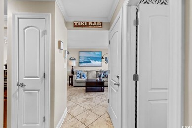 Hallway featuring crown molding