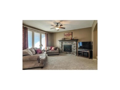Upgraded carpet & stunning stone fireplace.