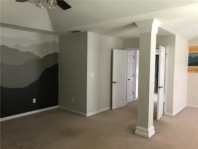 Unfurnished bedroom with carpet floors and a ceiling fan