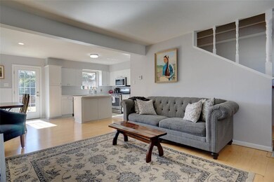 Living area open to the kitchen and dining