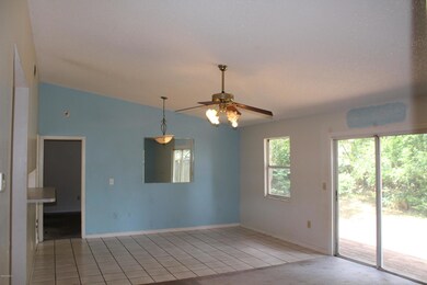 Wide angle view of living/dining combo