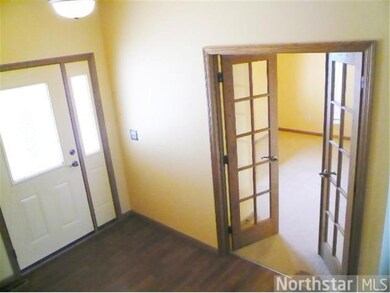 Main floor office with glass french doors situated