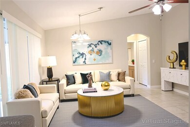 Living area with light tile patterned floors, ceil