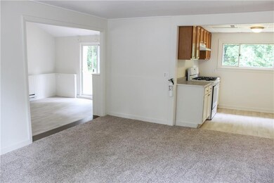 The flowing open floor plan leads to the kitchen a