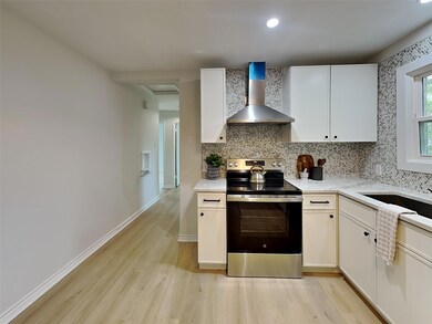 Kitchen featuring stainless steel electric range, 