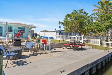 80' of seawall, seating area off the canal