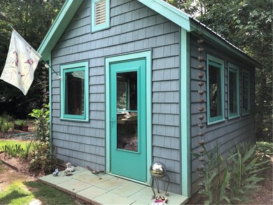The most adorable potting shed with electricity.