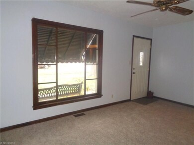 Ceiling fan, plus awnings and shade from the tree keep the living room nice and cool in  the summer.