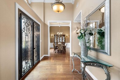 Foyer Area Entrance with Wine Cellar and Formal Dining Area to the Left