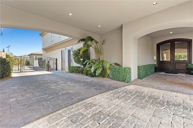View of exterior entry featuring a gate, french do