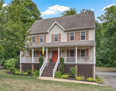 Colonial-style house with covered porch and a fron