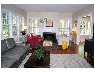 LIVING ROOM WITH WOOD FLOORING AND FIREPLACE