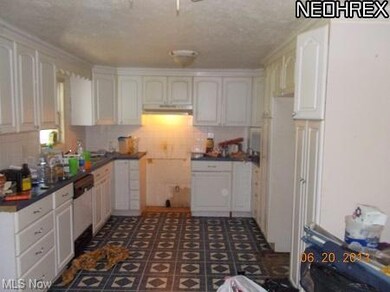 large kitchen with tons of cupboards and counter s
