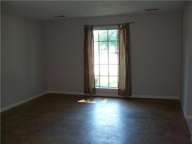 Freshly painted living room with updated stained a