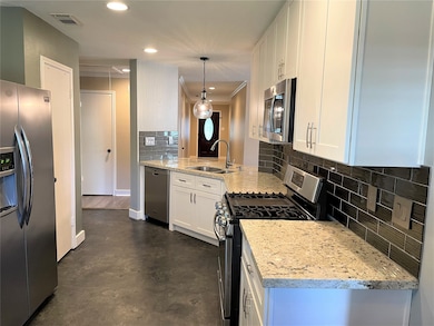Shaker style cabinetry with soft close drawers.