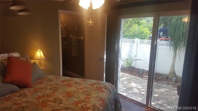 Downstairs suite has access to paver-covered lanai