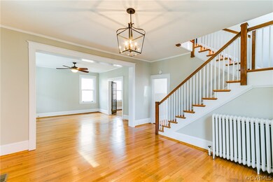 Upon entering, you will be greeted by this home's extra large entryway with beautiful oak flooring and brand new Shades of Light light fixtures.