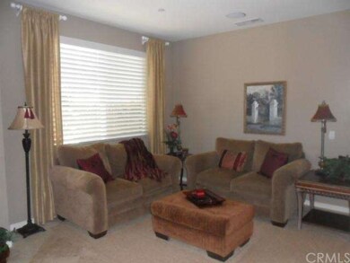 Formal Living Room with Travertine Flooring and Ru