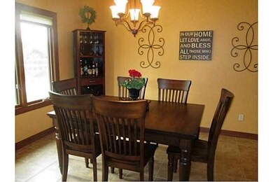Exterior Front. Sunny dining area. Overlooks back 