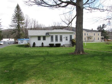 House sits back away from the road.