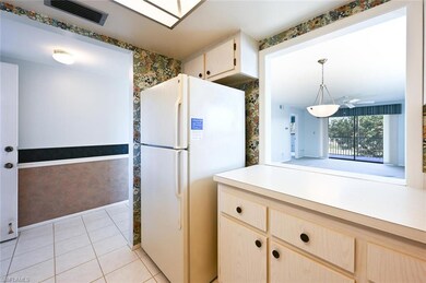 Kitchen features a pass-through opening