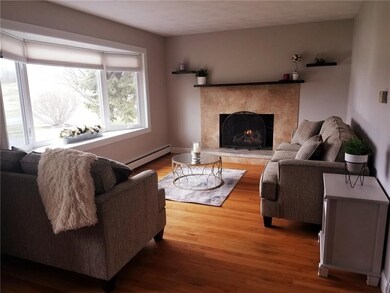 Living room is spacious, features a bay window, ga