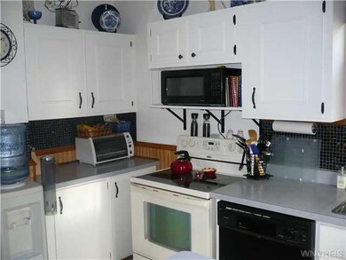 Kitchen. Update kitchen with loads of cabinets.