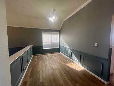 Spare room with vaulted ceiling, ornamental moldin