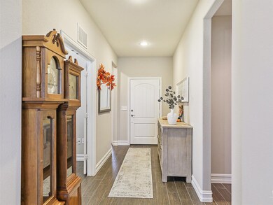 entry hall with wood style floors