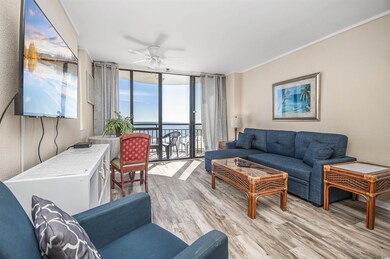 Living area featuring expansive windows, ceiling fan, a water view, wood finished floors, and crown molding
