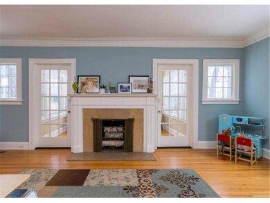 Living room with fireplace & view of sun room