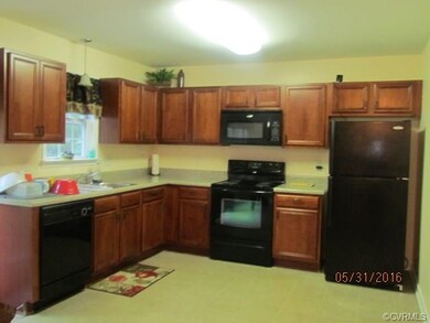 Open kitchen with plenty of cabinets, all applianc