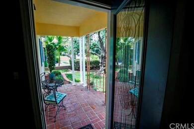 ANOTHER VIEW OF FRONT PORCH & BEAUTIFUL LEAD-INLAY FRONT DOOR. 